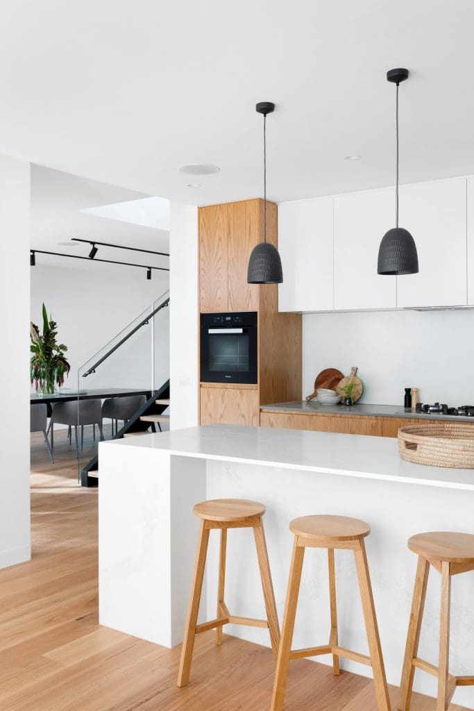 A modern looking kitchen area of a condo unit