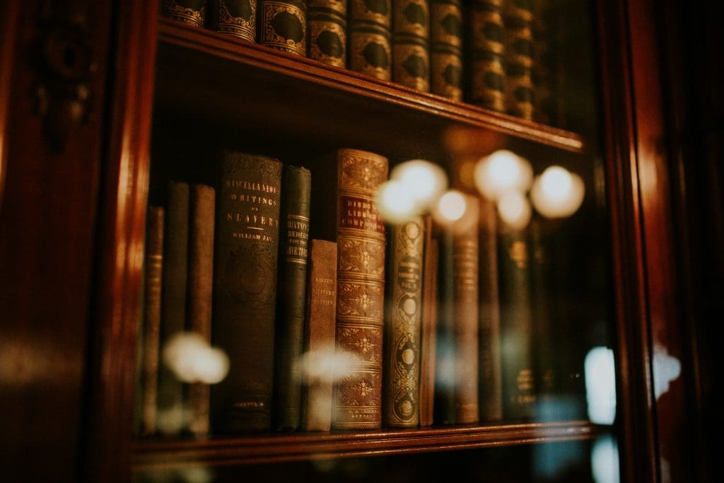 A close up of books behind a glass case